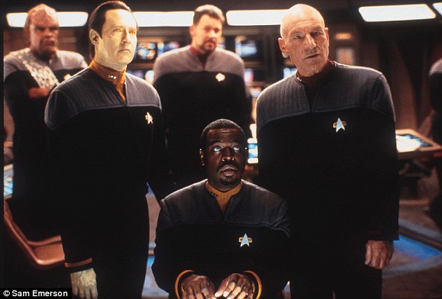 The wearable device was inspired by combadges worn in Star Trek (still from 2003 film Star Trek: Nemesis pictured). Combadges were fitted to their uniforms and used by Starfleet members to communicate with each other while on board ships, including the USS Enterprise