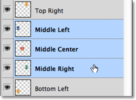 Selecting the Middle Left, Middle Center and Middle Right layers in the Layers panel. 