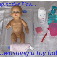 Washing a toy baby caring for a baby activities for kids